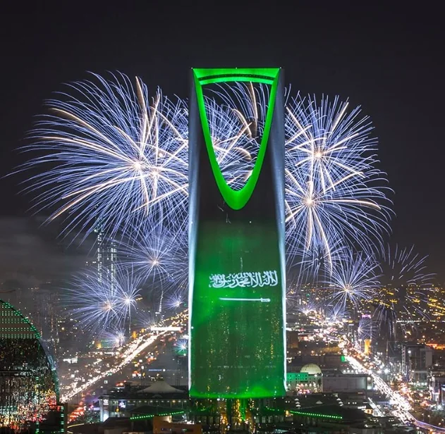 Kingdom Centre in Riyadh lit green with fireworks for Saudi National Day